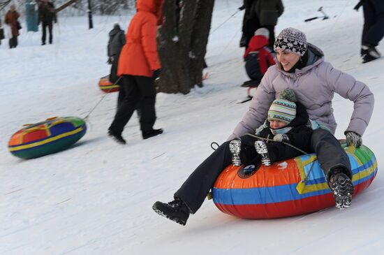 Sliding down the ice hill in Kolomenskoye
