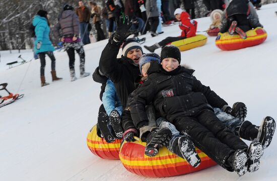 Sliding down the ice hill in Kolomenskoye