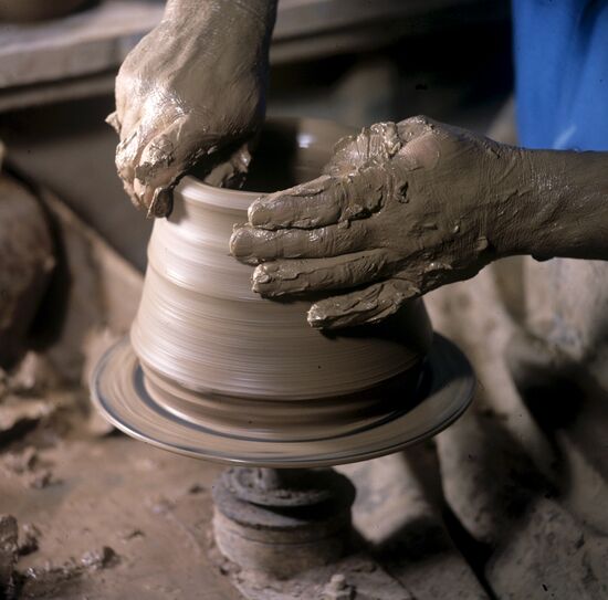 Making a jar on potter's wheel