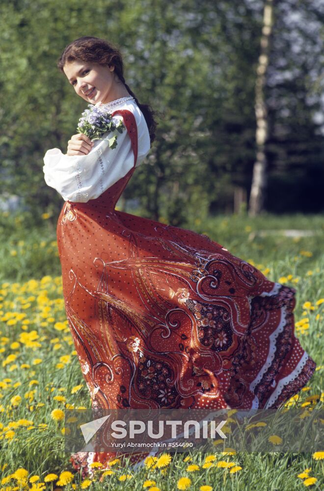 Girl wearing Russian sarafan (summer dress)