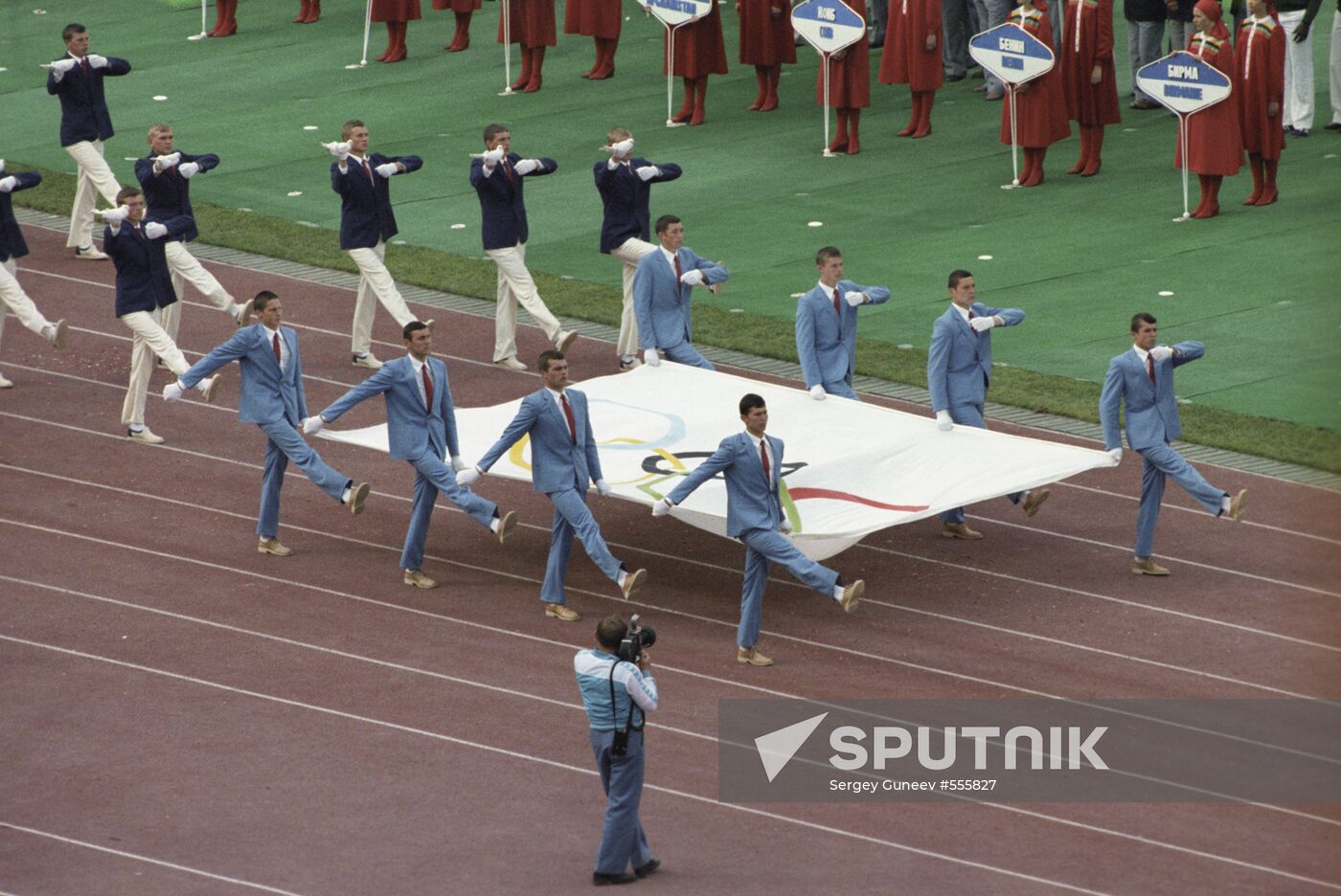 Carrying the Olympic flag