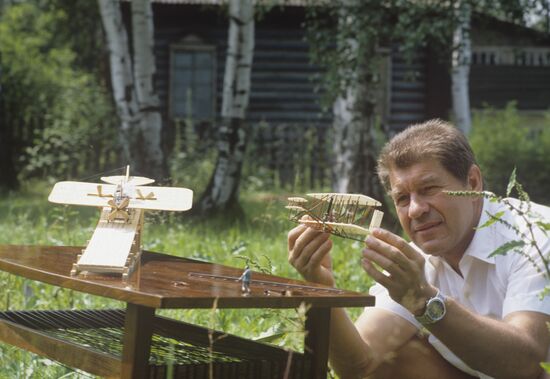 Pilot Yuri Ovsyannikov with model aircraft