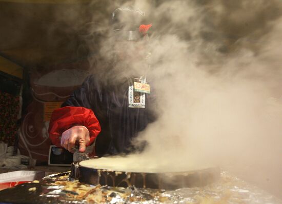 Making and selling pancakes at first day of Maslenitsa festival