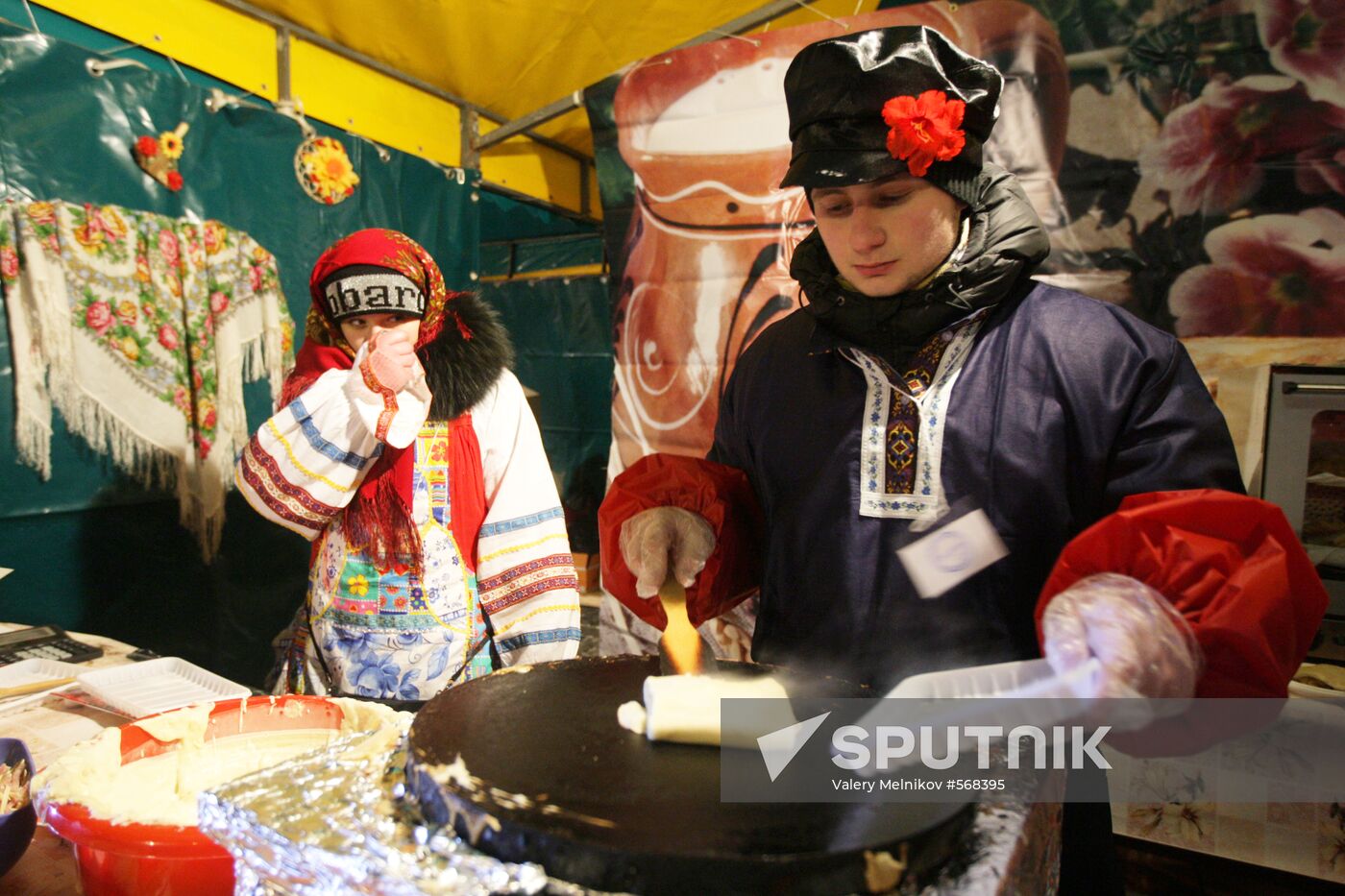 Making and selling pancakes at first day of Maslenitsa festival