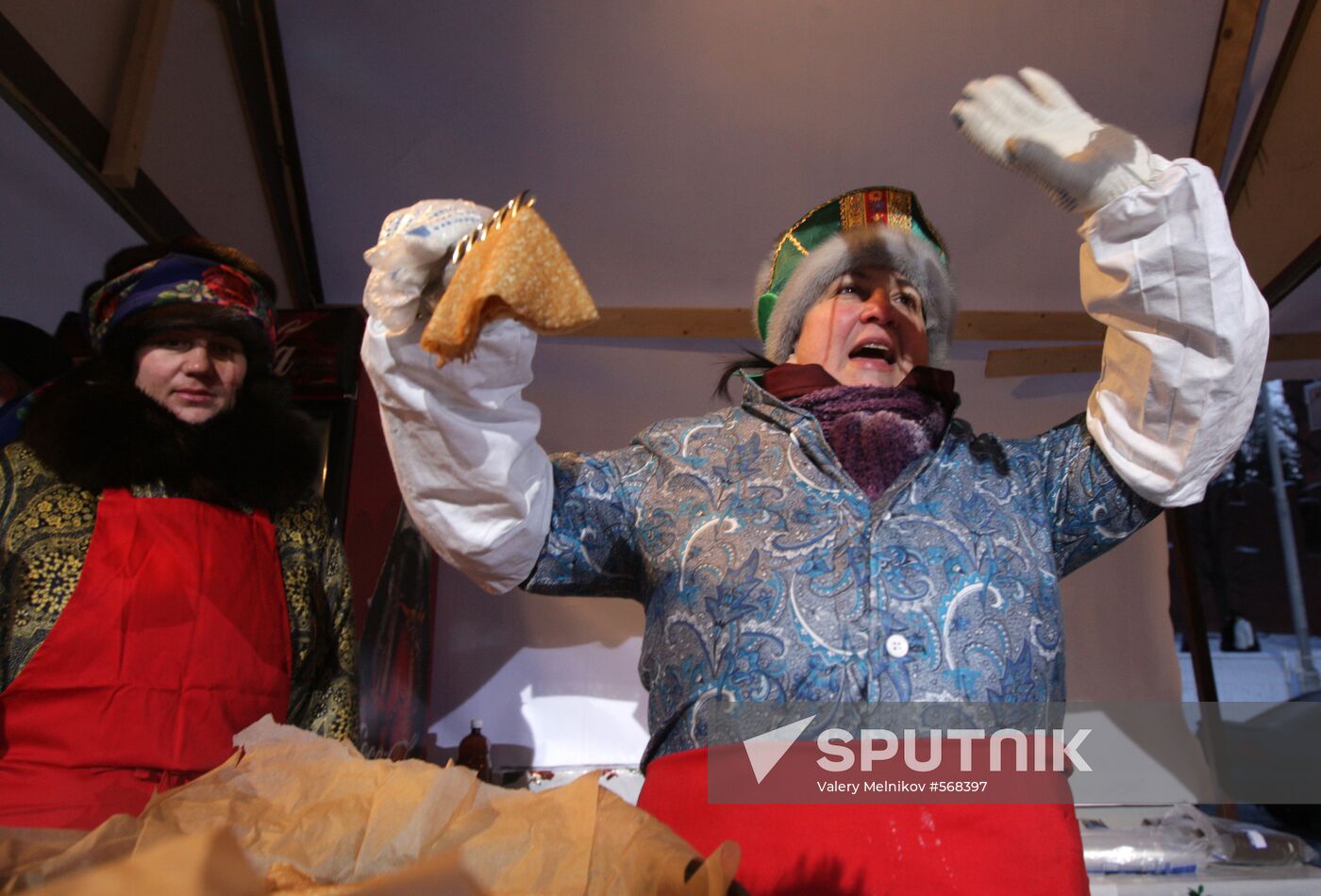 Making and selling pancakes at first day of Maslenitsa festival