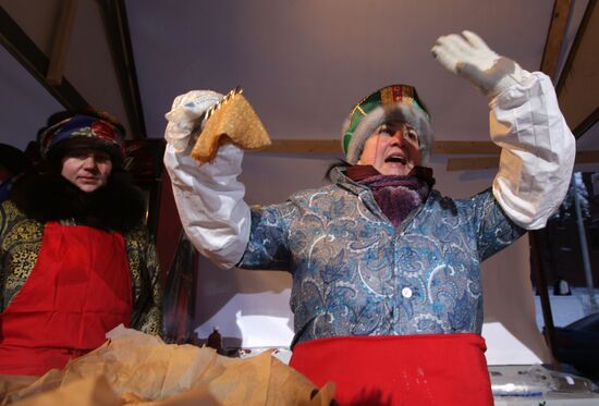 Making and selling pancakes at first day of Maslenitsa festival