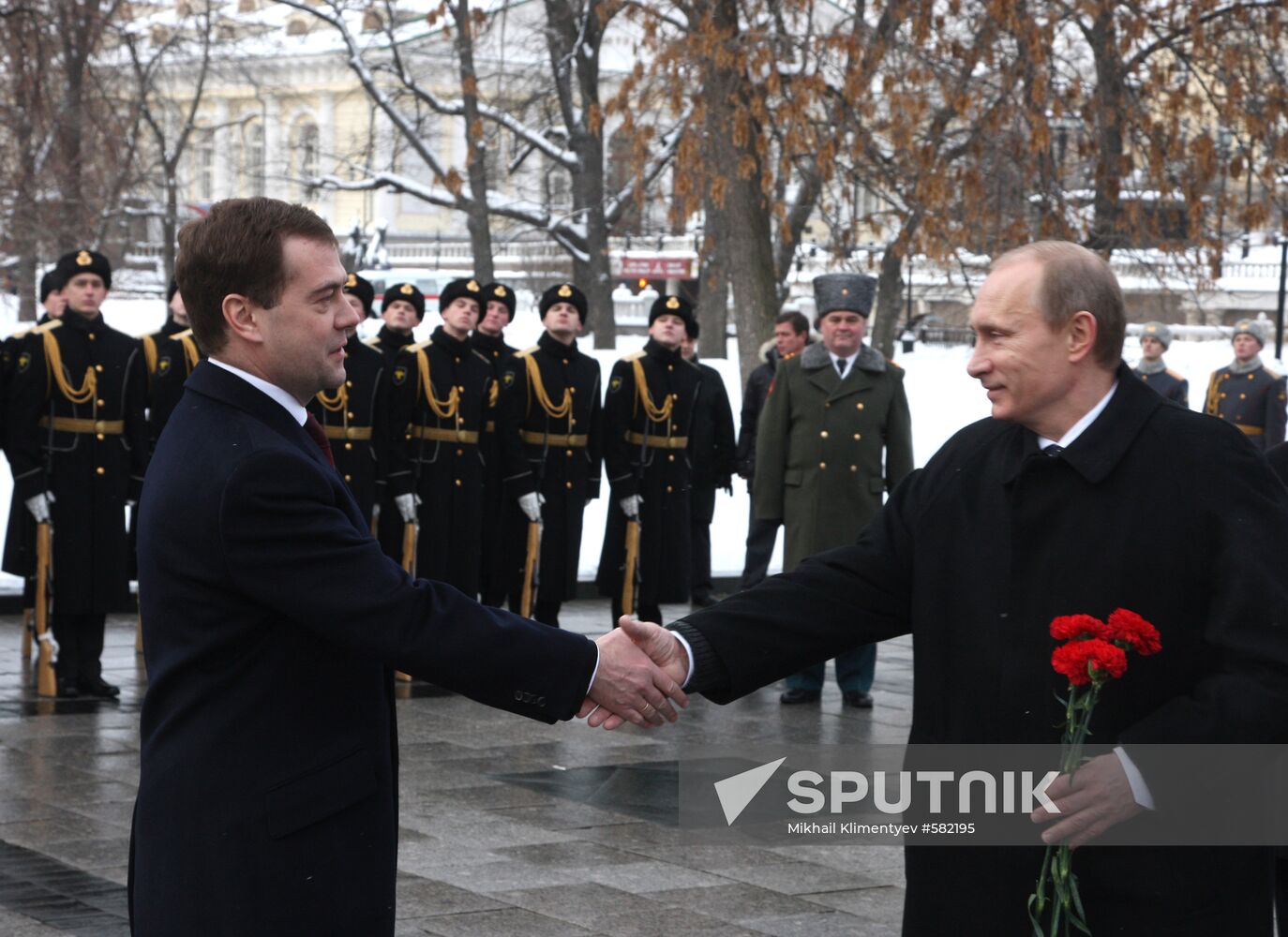 Dmitry Medvedev and Vladimir Putin attending ceremony