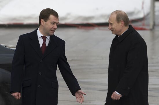 Dmitry Medvedev and Vladimir Putin attending ceremony