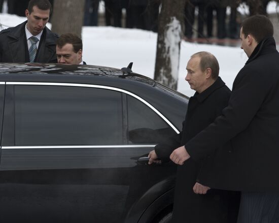 Dmitry Medvedev and Vladimir Putin attending ceremony