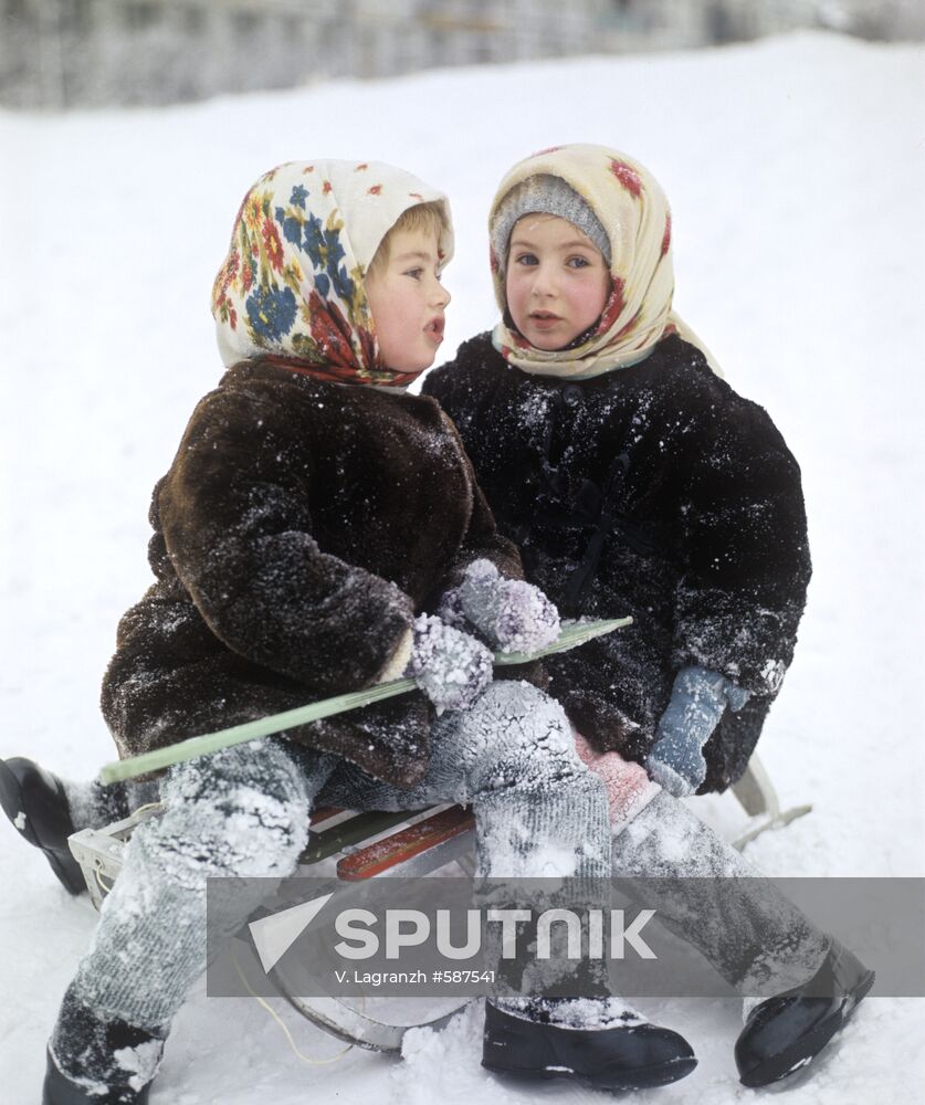 Children driving in sledge