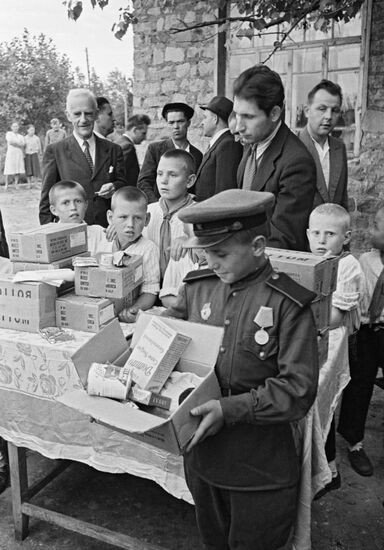 Lend-Lease food packages handed out