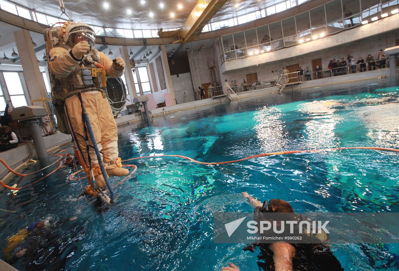 Cosmonaut diving into water at hydrolab training facility