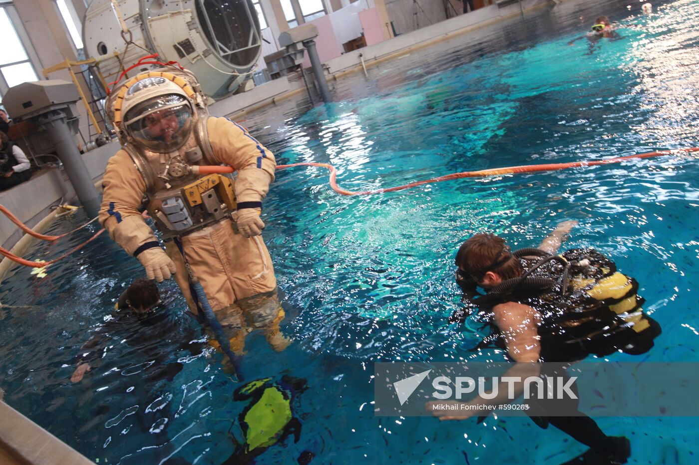 Cosmonaut diving into water at hydrolab training facility
