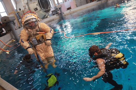 Cosmonaut diving into water at hydrolab training facility