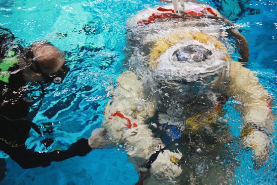 Cosmonaut diving into water at hydrolab training facility