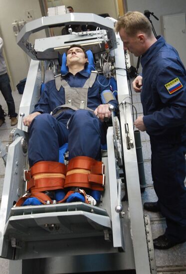 Preparing cosmonaut for tests at TsF-18 centrifuge