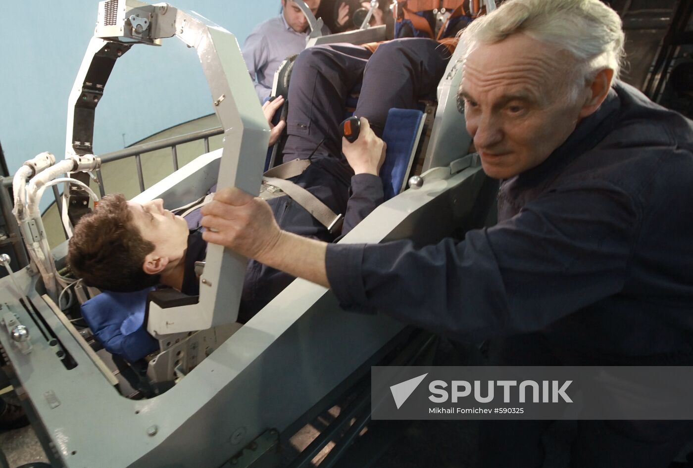 Preparing cosmonaut for tests at TsF-18 centrifuge
