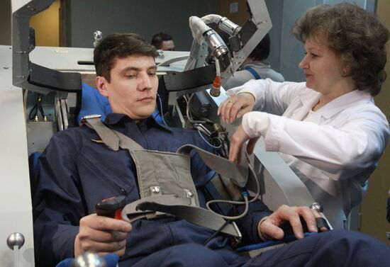 Preparing cosmonaut for tests at TsF-18 centrifuge