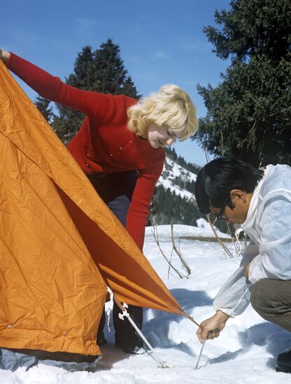Tourists setting up tents