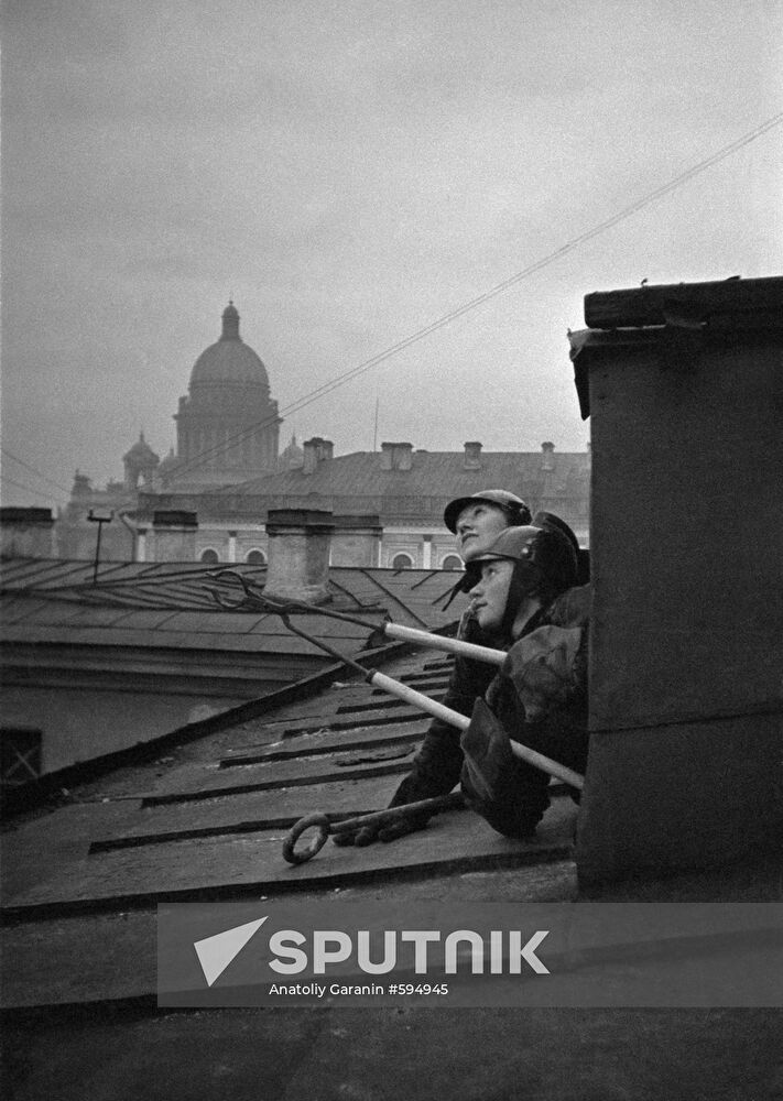 Air-raid wardens on a roof in Leningrad