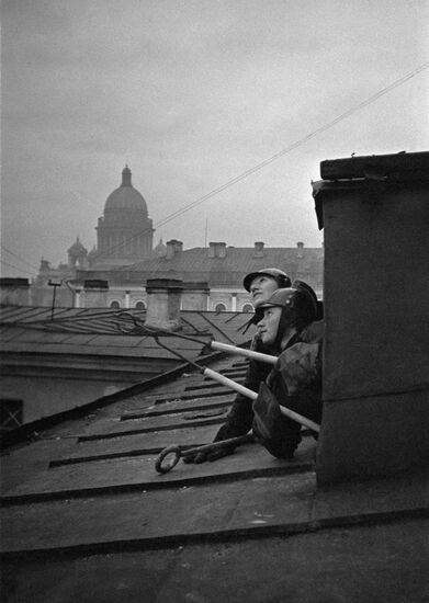 Air-raid wardens on a roof in Leningrad