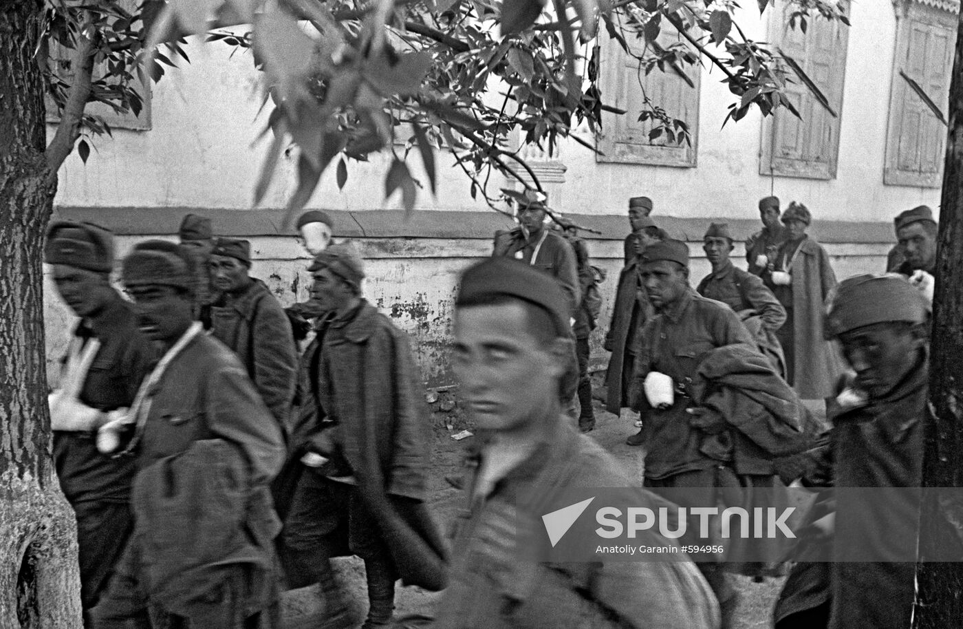 Wounded Red Army soldiers walking away from the frontline