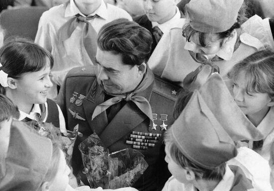 U.S.S.R. pilot-cosmonaut Georgy Beregovoi and members of the Young Pioneer League