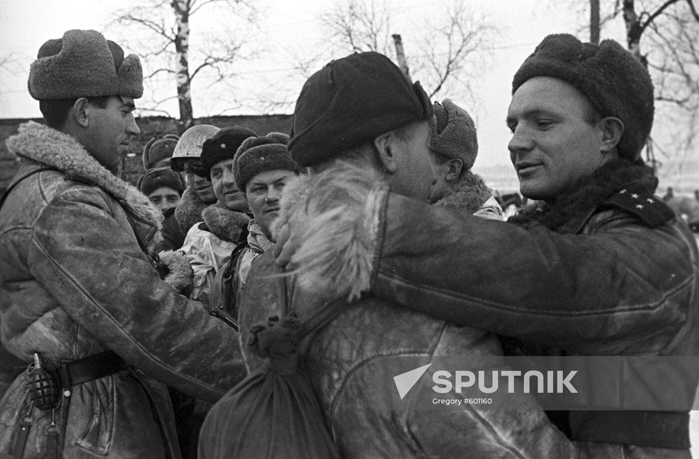 Soldiers greeting each other after breaking the blockade