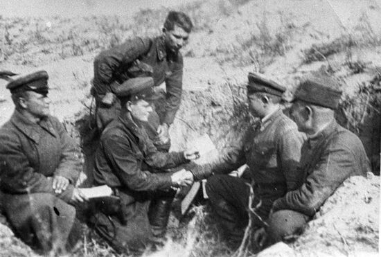Soviet fighters receiving Komsomol membership card