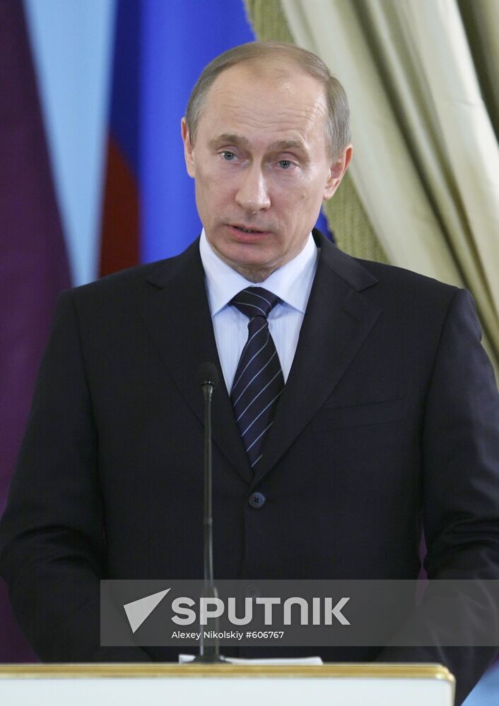 Vladimir Putin and Hamad Bin Jassim Bin Jabor Al Thani