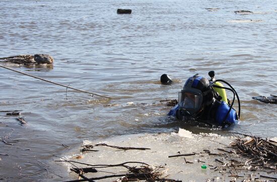 Rescuer diving in ice water