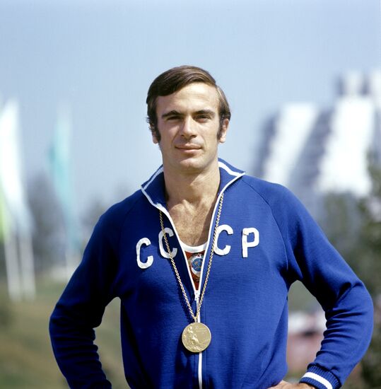 Viktor Saneev with Olympic medal
