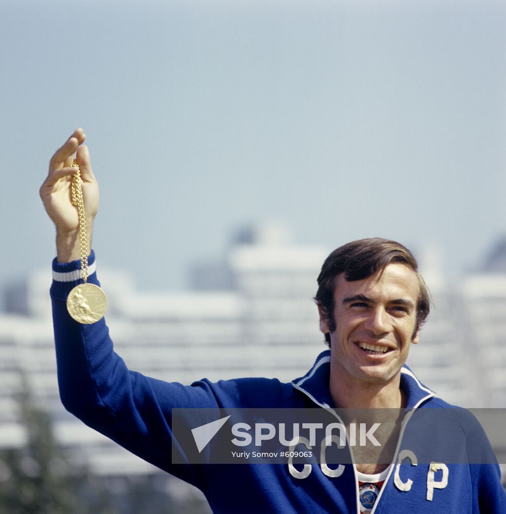 Viktor Saneev with Olympic medal