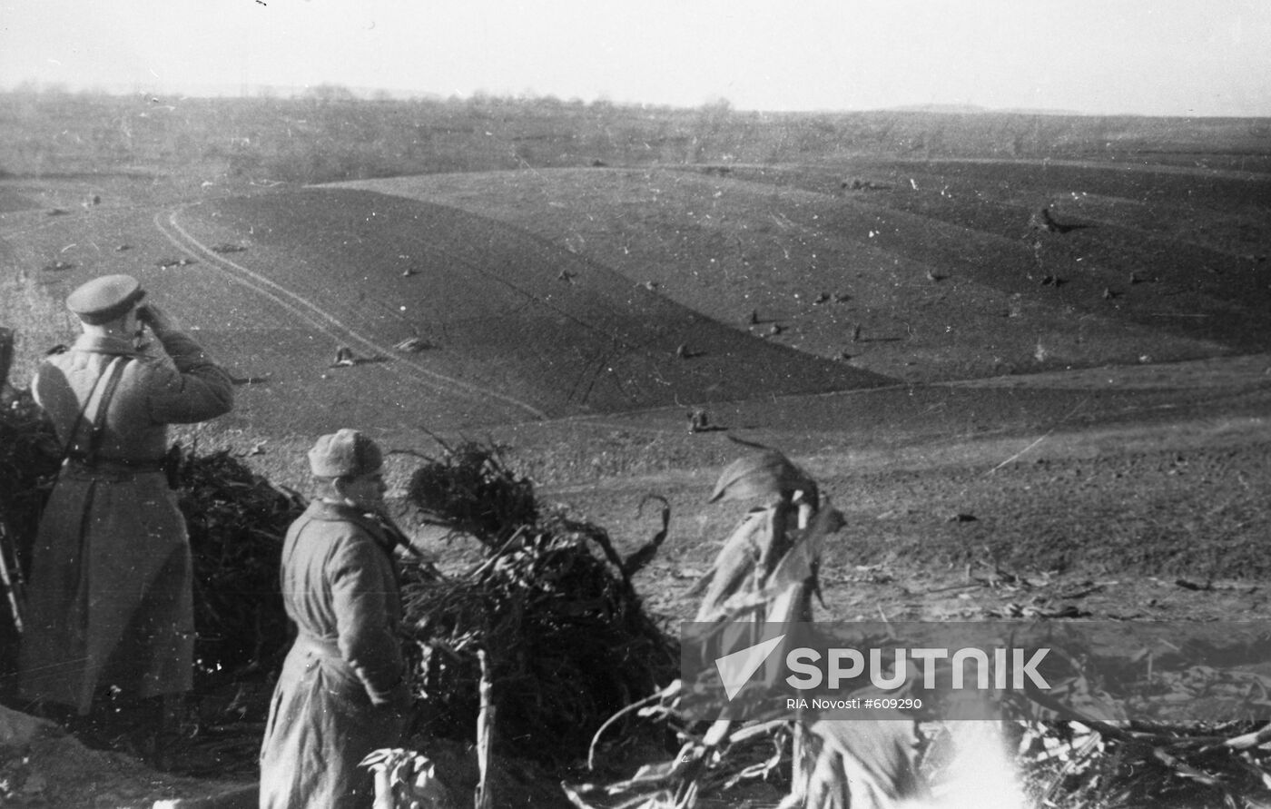 Soviet command watching tank attack