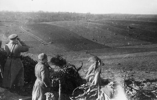 Soviet command watching tank attack