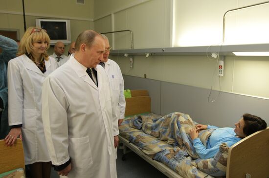 Vladimir Putin visits injured in hospital