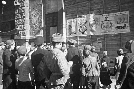 City residents looking at cartoons