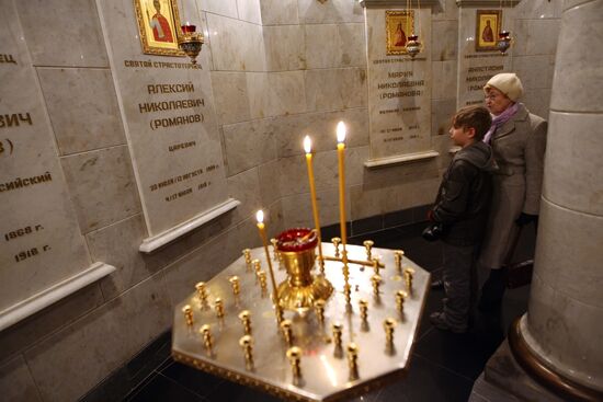 Believers at memorial wall in Church on Blood