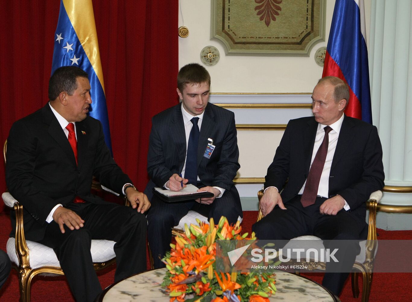 Prime Minister Vladimir Putin meets with Hugo Chavez