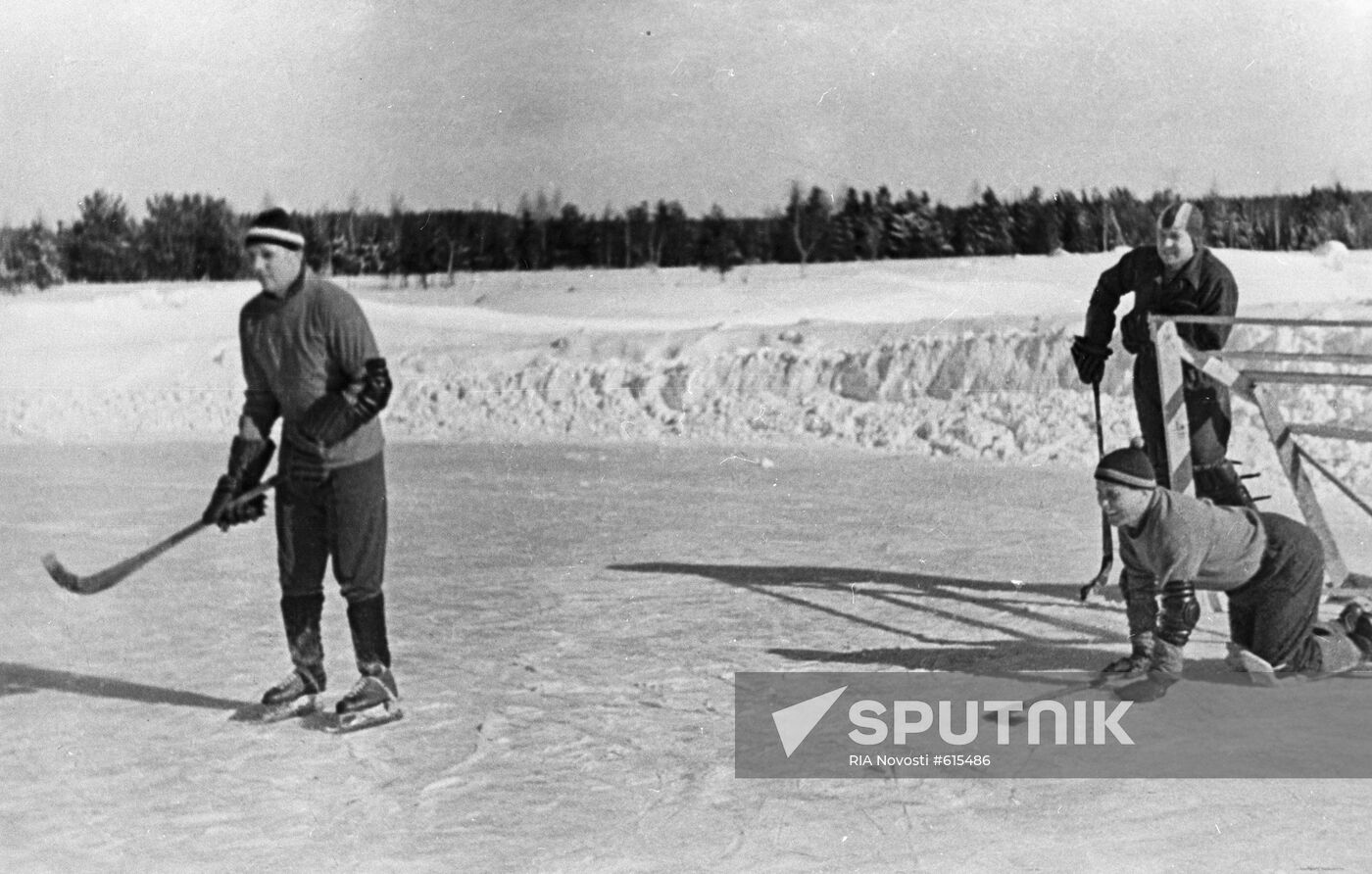 Yuri Gagarin, Alexey Leonov and Pavel Popovich play hockey