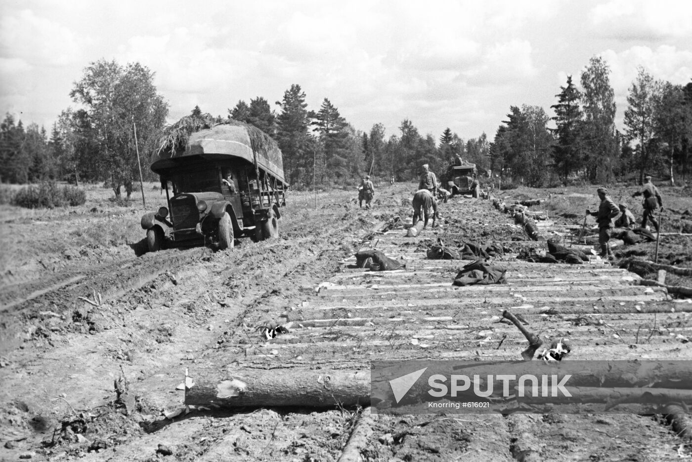 Soviet soldiers build the road on marshland