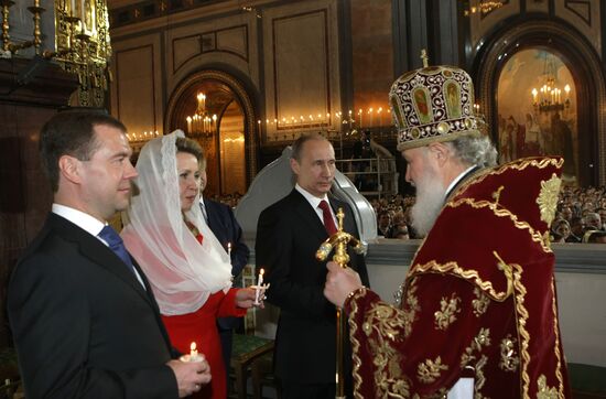 Dmitry Medvedev and Vladimir Putin attend Easter service