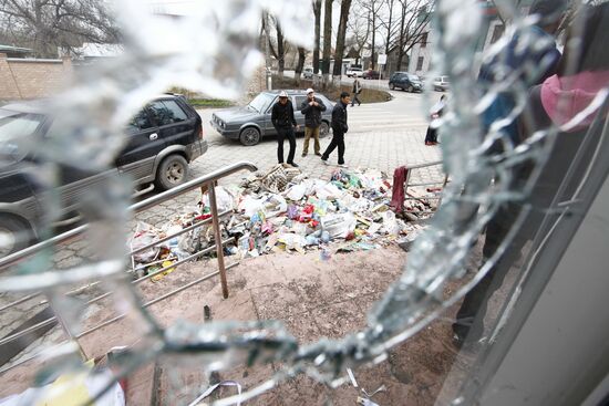 Smashed shop window in Bishkek