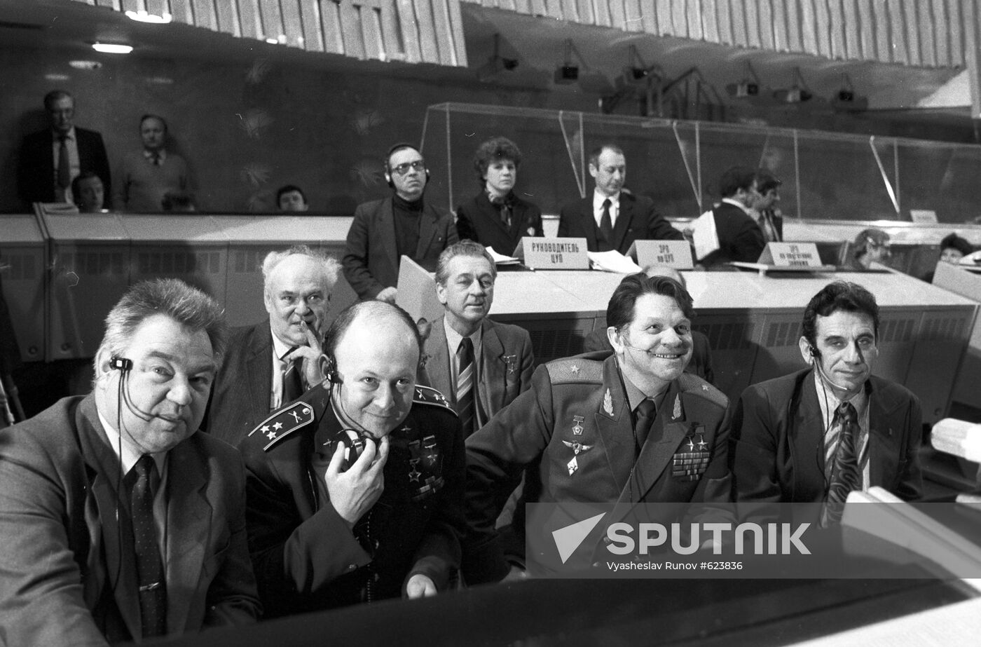 Group of pilot-cosmonauts at round table
