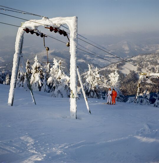 Ski lift carries downhill skiers