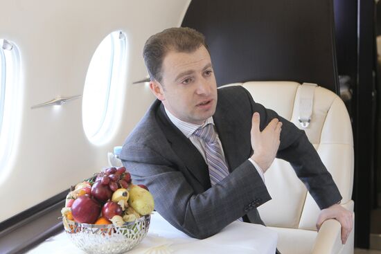 Alexander Zolotarev at cabin of Hawker 4000 plane
