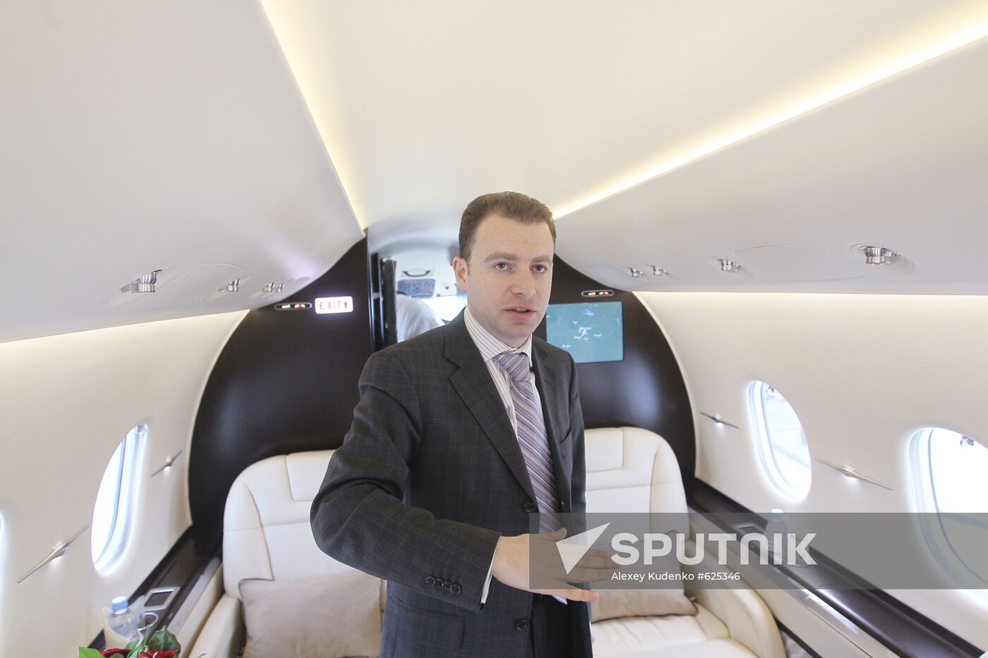 Alexander Zolotarev at cabin of Hawker 4000 plane