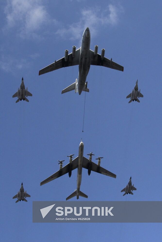 IL 78 refuels TU 95MS bomber accompanied by MiG 29 jets