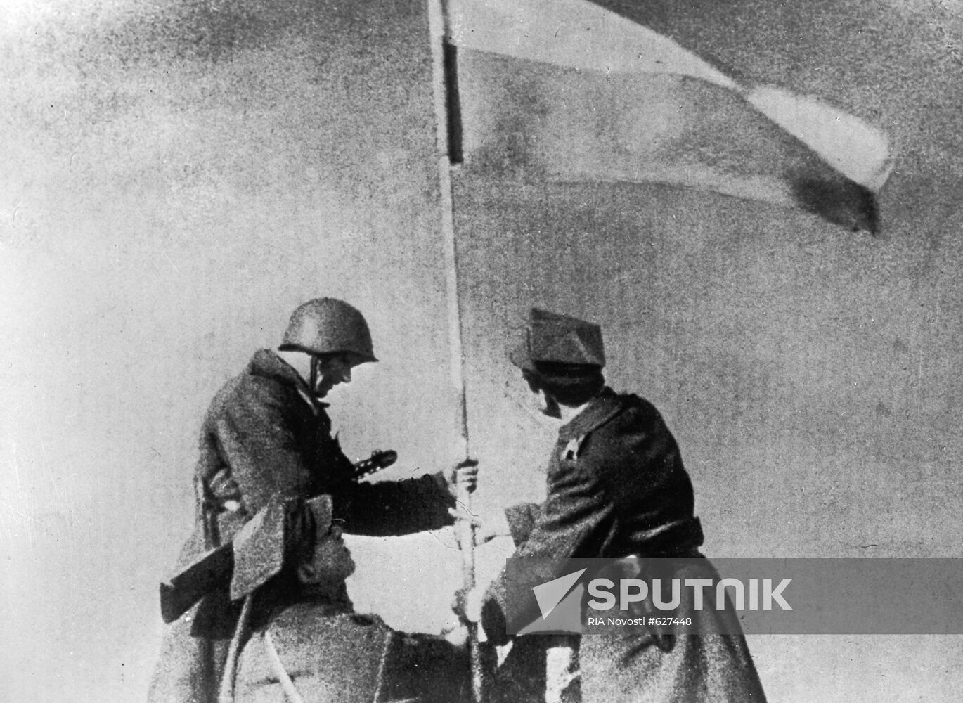 Soviet and Polish soldiers planting a Victory flag