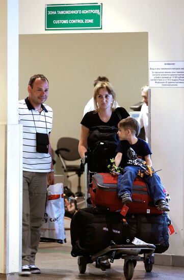 Passengers arrive at Domodedovo airport from London